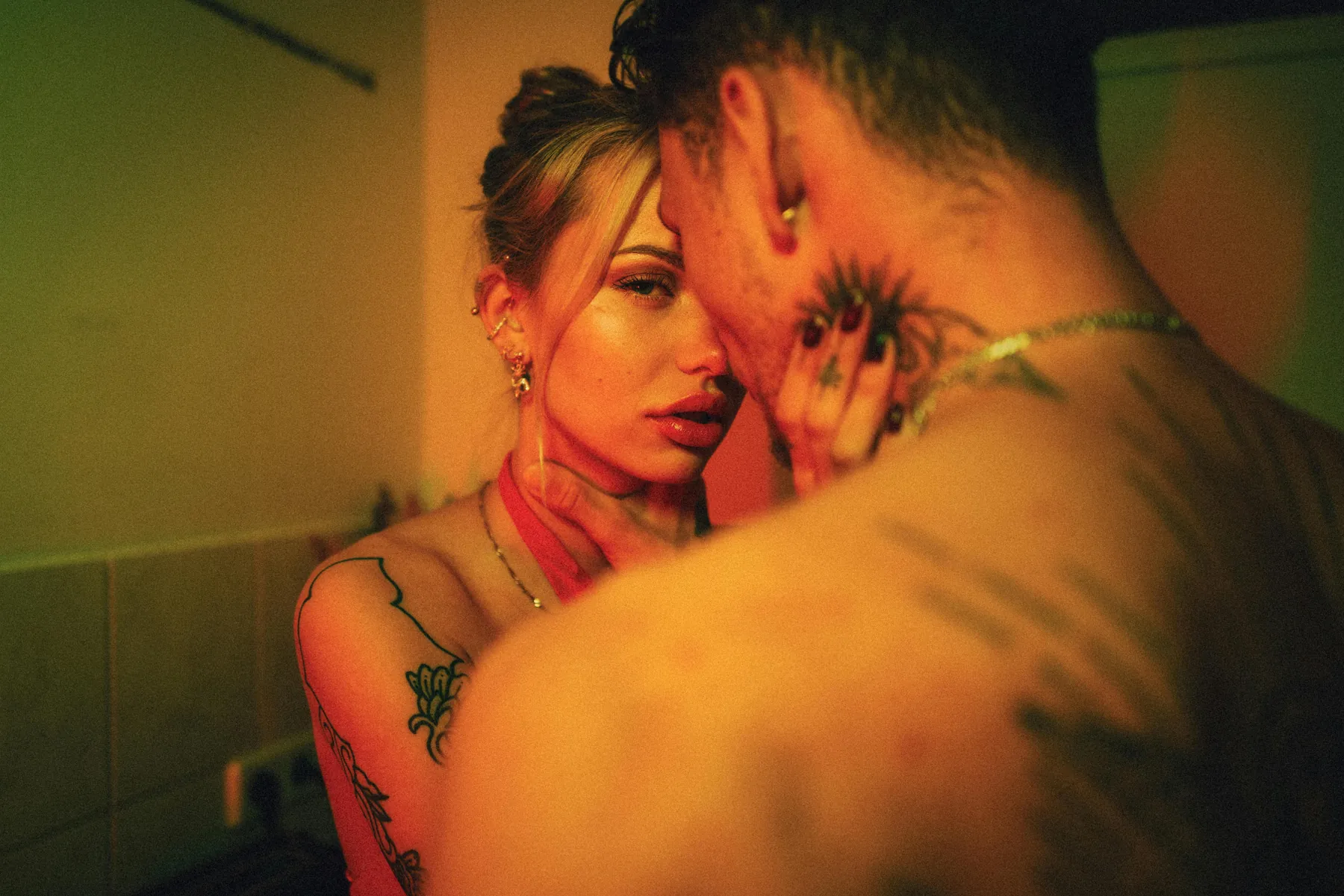 A couple embracing in warm amber light