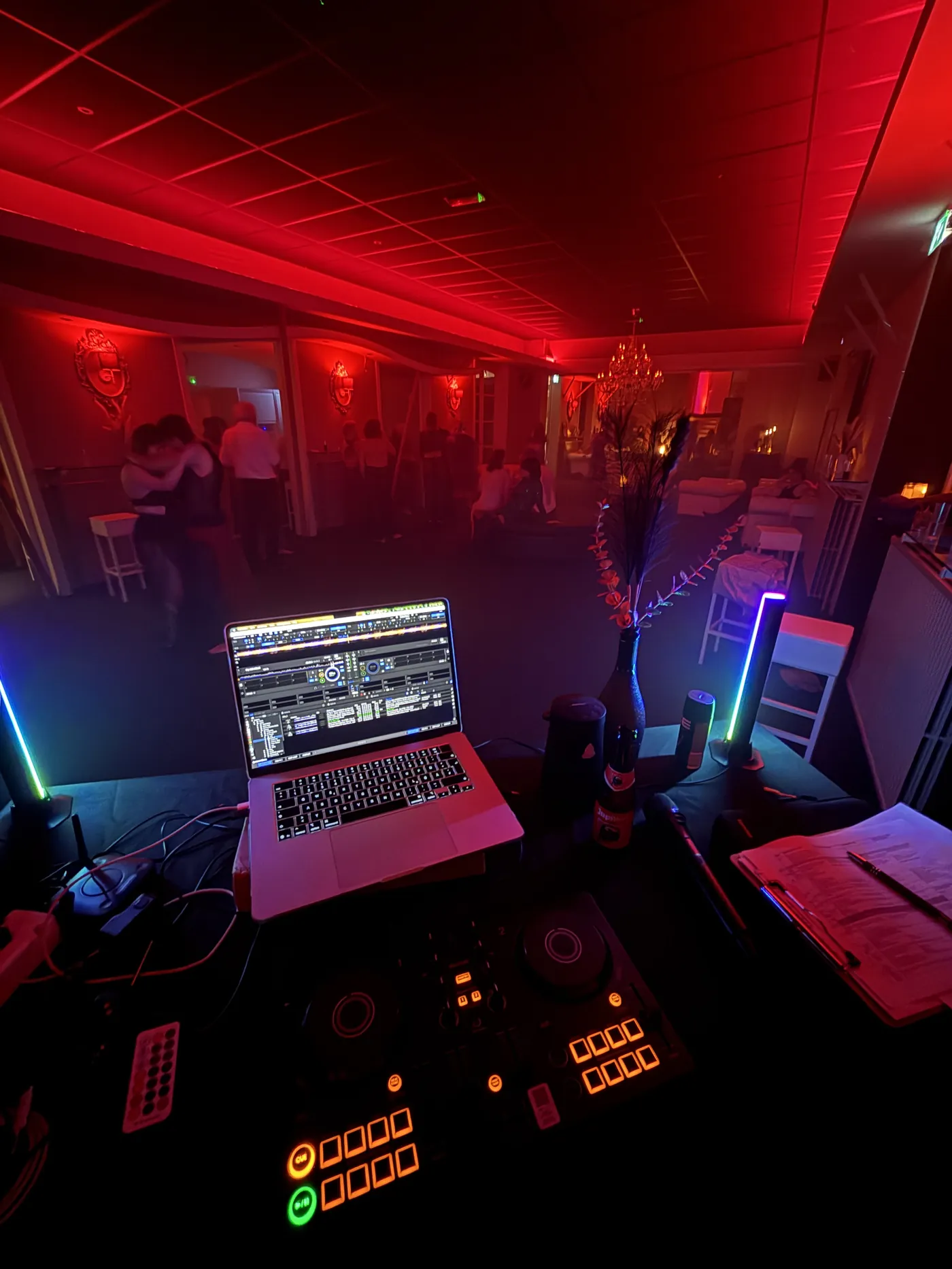DJ booth in red light during the free flow