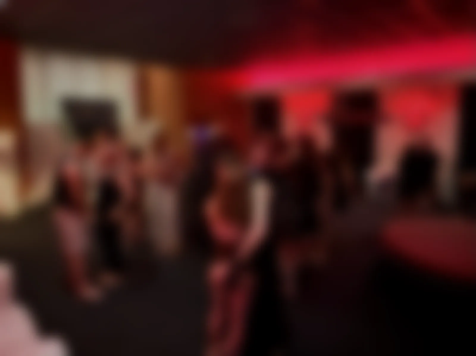 Guests standing together during a Sphere, softened for privacy